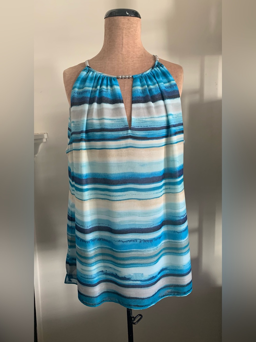 WHBM sleeveless halter top featuring chiffon-type fabric w/ a beaded neckline.